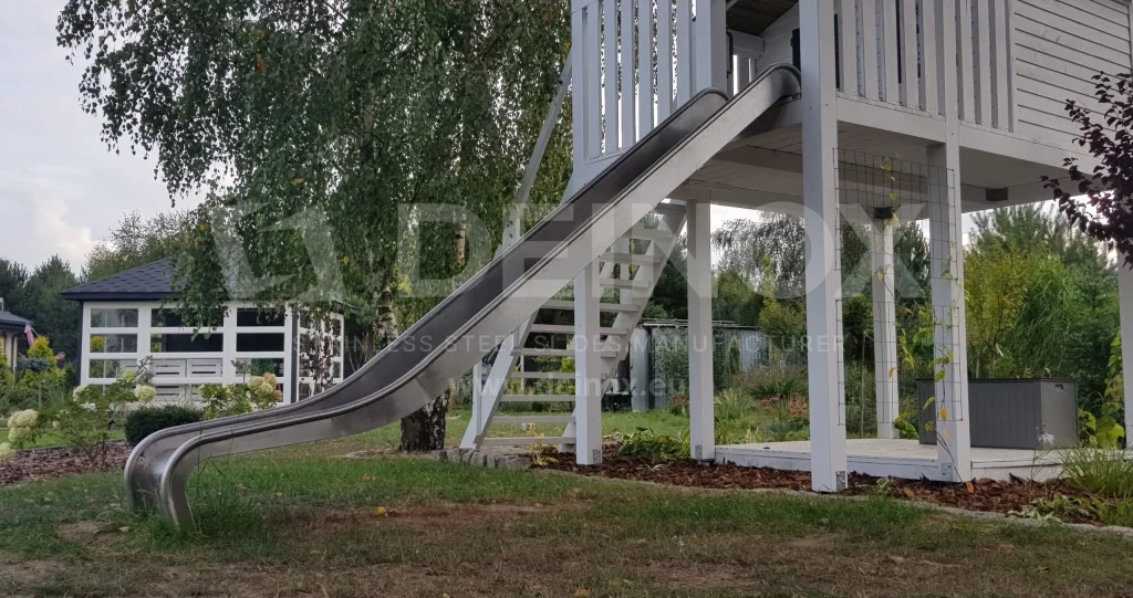 Playground tower with mounted slide